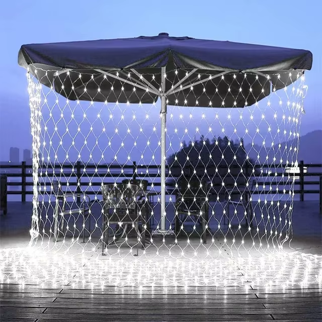 LED Net Lights draped over outdoor umbrella at night